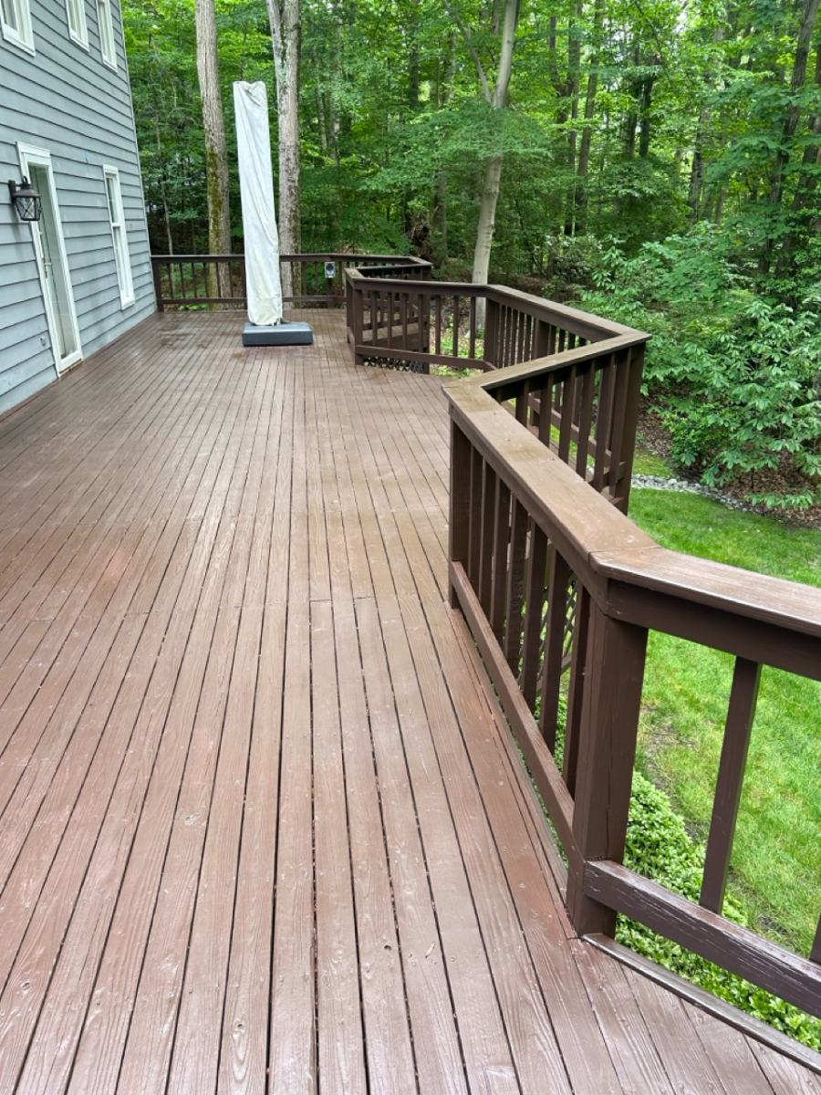 Wooded backyard deck with deep brown stain