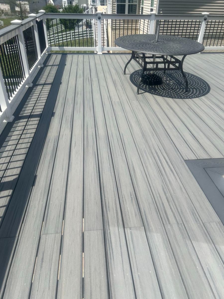 Modern gray composite deck with patio furniture